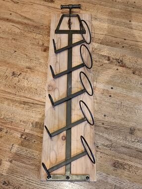 Rustic Metal Wall-Mounted Bottle Rack on Wood Backing